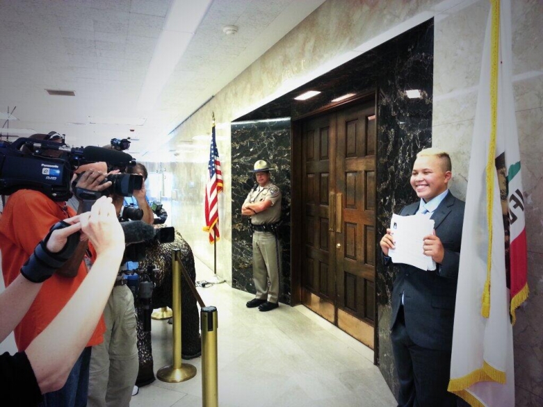 Ashton Lee delivering petitions to Gov. Brown
