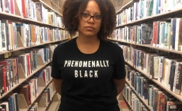Teacher wearing a tee shirt that says phenomenally black