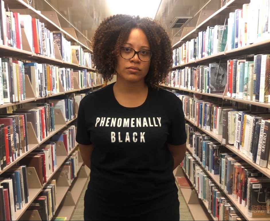 Teacher wearing a tee shirt that says phenomenally black