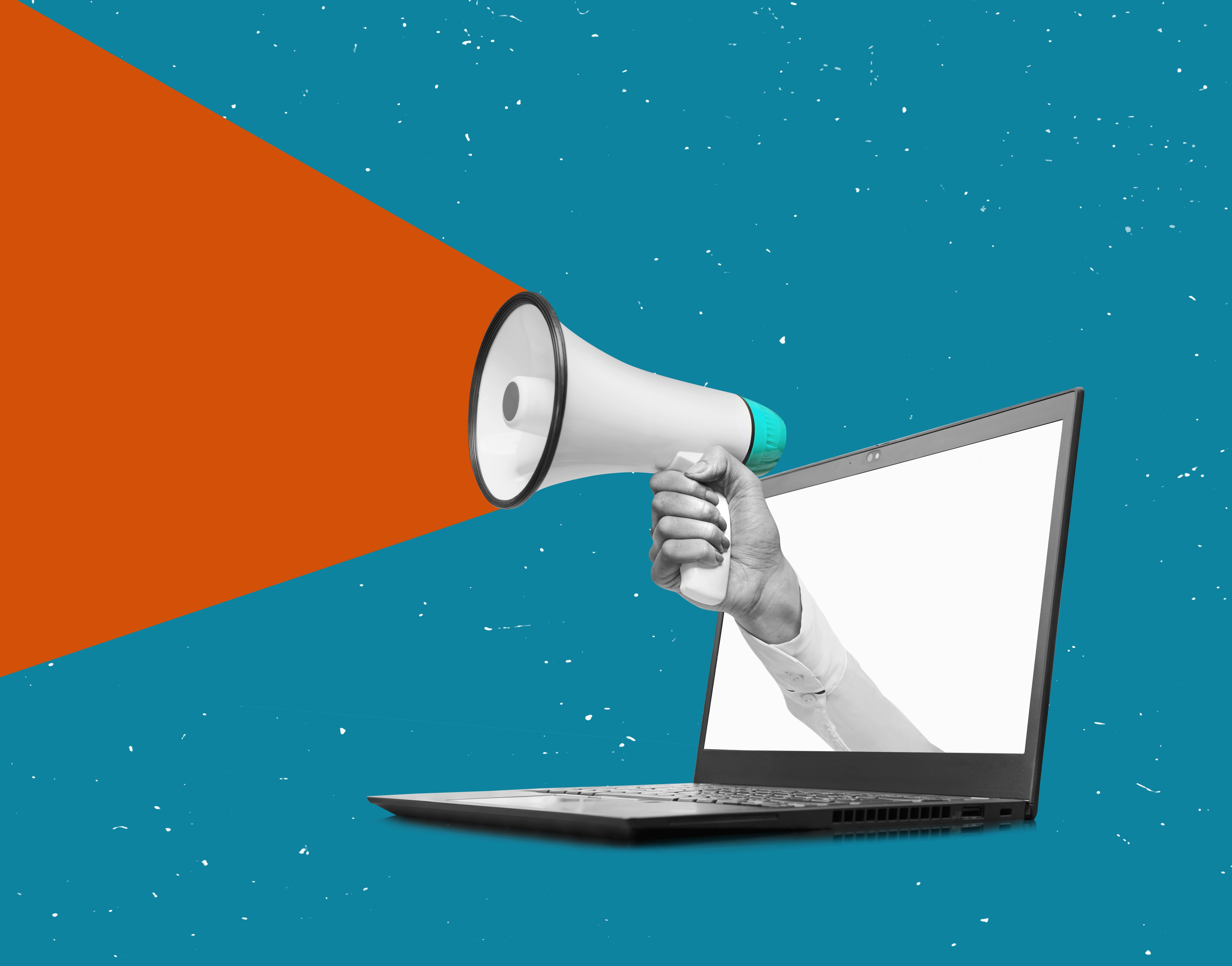 Hand holding a megaphone from laptop monitor