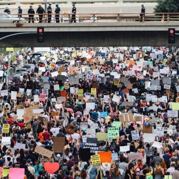 Protestors march under a bridge in Los Angeles. 