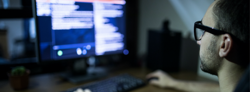 man looking at computer