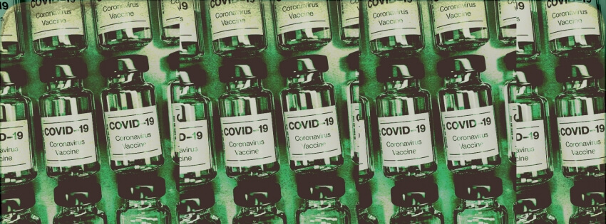Covid-19 Vaccine vials are stacked on a table. A solid green color is overlaid for a visual affect.