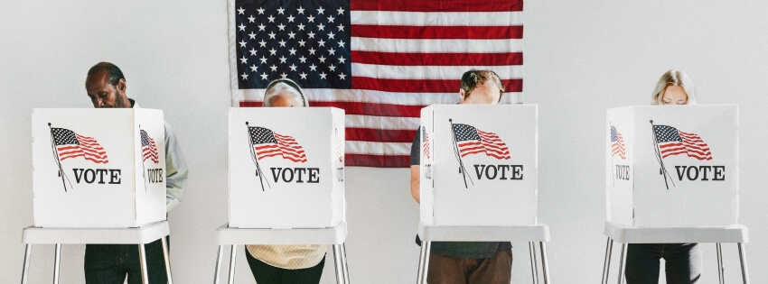 line of people at voting booths