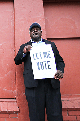 Dorsey Nunn with sign Let me Vote