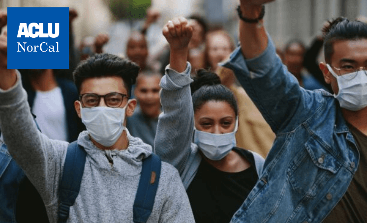 young people wearing masks protesting 