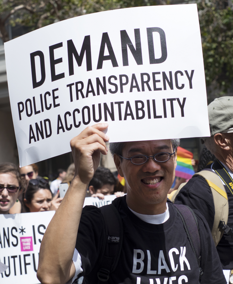 Marcher with Demand Police Transparency sign