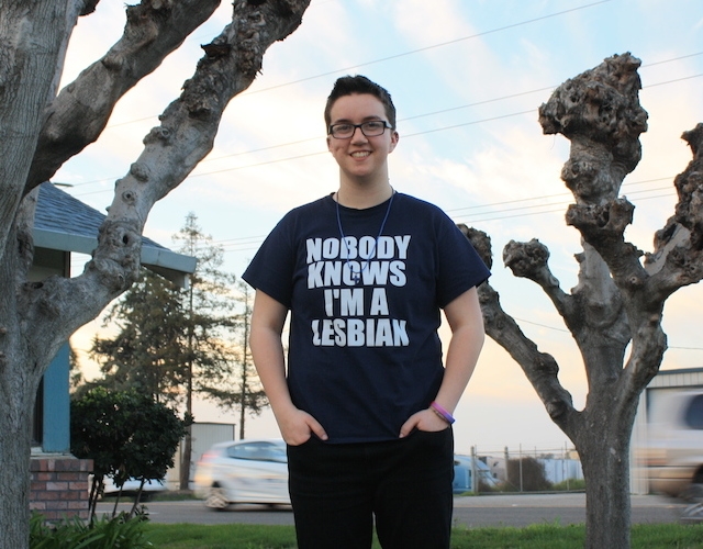 ACLU client Taylor Victor wearing t-shirt that reads "Nobody Knows I'm a Lesbian"