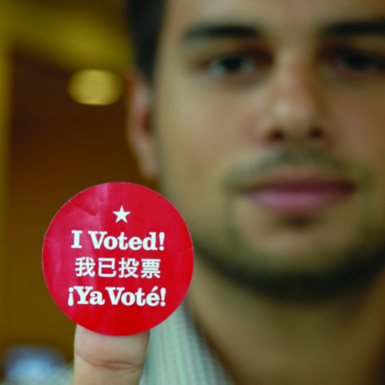 Individual holding vote sticker