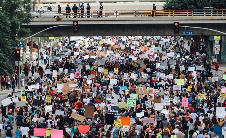 Protestors march under a bridge in Los Angeles. 