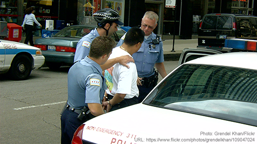 A man being arrested via ACLU.org
