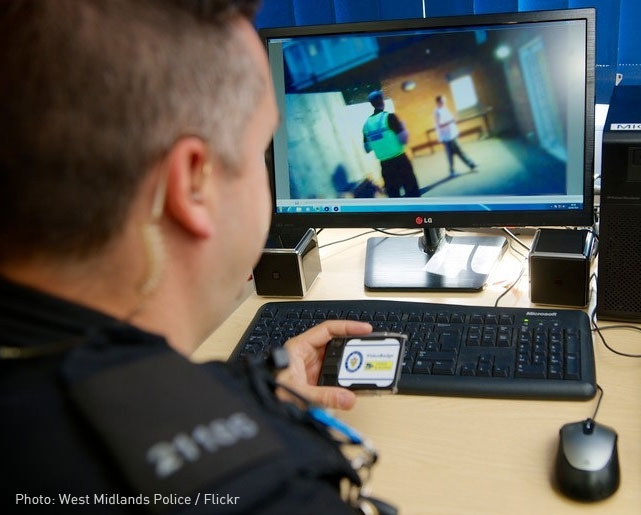 policeman looking at body cam footage