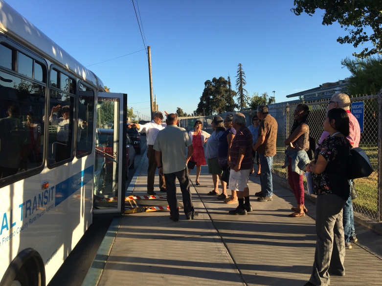 West Park residents gather outside the bus on the day it debuted