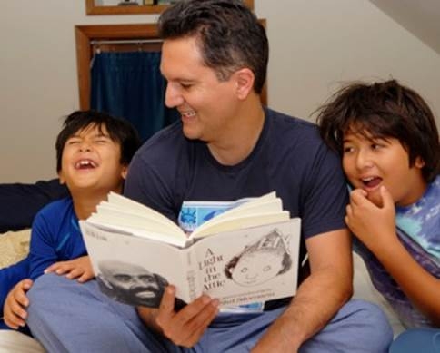Abdi Soltani reads his "A Light in the Attic" to his two sons