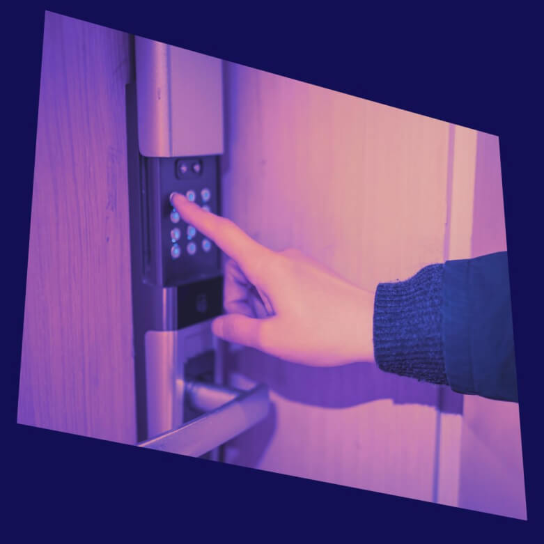 A hand pressing button on a digital door lock 