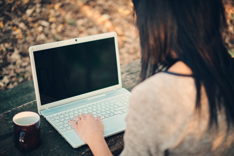 person at a laptop via Shutterstock