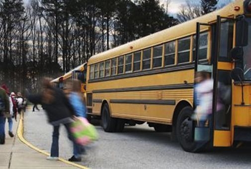 children getting off a school bus