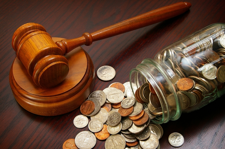 Coins in a jar with a gavel