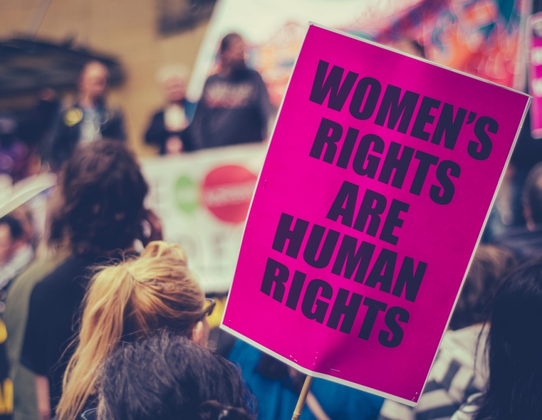 Close up of a pro-choice protest sign in a crowd of protesters. It reads Women's Rights Are Human Rights