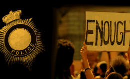 police badge next to a sign saying "ENOUGH"