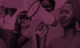 Woman holding bullhorn with purple filter