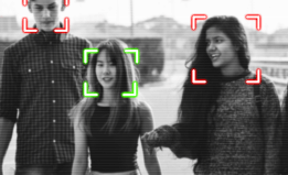 three students walking with face recognition software following them