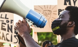 Cropped photo of man with megaphone