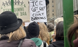 Image of a sign that says, "ICE get out of court buildings." 