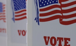 A color photograph of voting booths