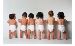 babies in diapers lined up