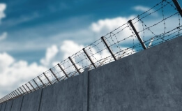 barbed wire on detention facility wall
