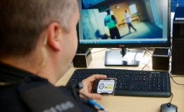 A police officer looking at body camera footage.