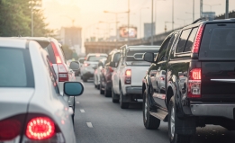 cars in a line of traffic on an urban road