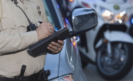 police officer writing a ticket