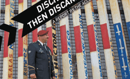 a photograph of a foreign-born U.S. veteran in front of the U.S./California border wall. The cover of our report "Discharged, Then Discarded: How U.S. veterans are banished by the country they swore to protect