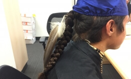 Eagle feather with graduation cap
