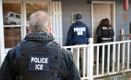 Photo of ICE and Police at the Door