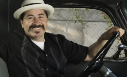 man driving a car