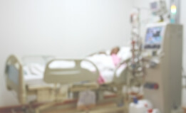 person in hospital bed