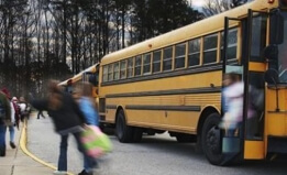 children getting off a school bus