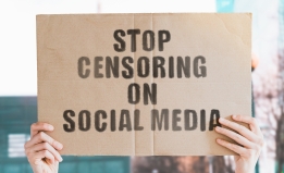 sign saying "stop censoring on social media"