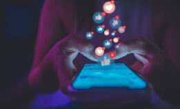 Person using a cell phone for social media