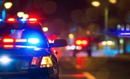 Photo of a police car at night. 