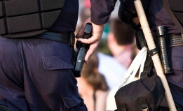 police officer reaching for gun