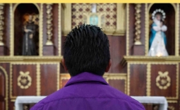 the back of a person's head, in a church