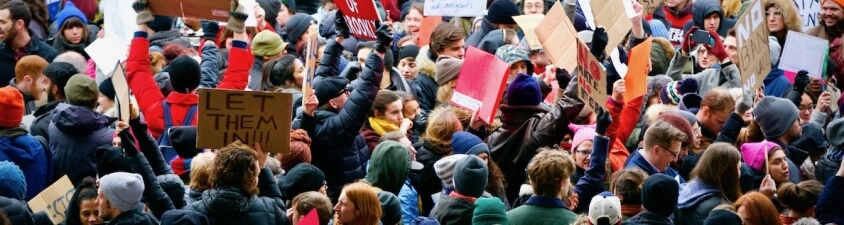 demonstrators holding signs